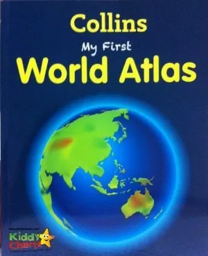 The image shows a child looking at a Collins My First World Atlas book in a Kiddy Lmarts store.