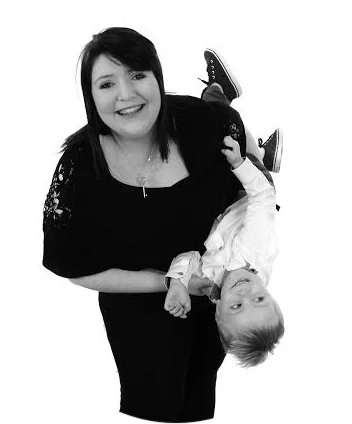 A person holds a baby.