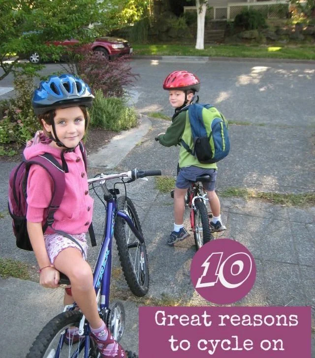 A person wearing a bicycle helmet and riding a hybrid bicycle is enjoying a scenic outdoor ride surrounded by trees and text reading 
