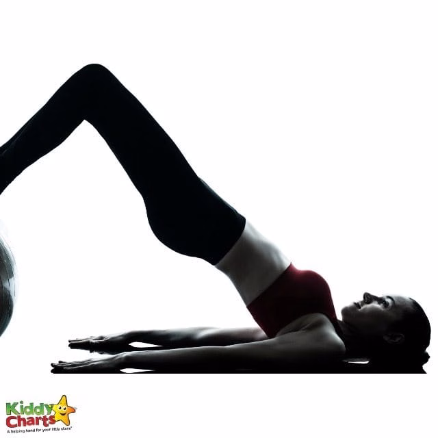 A person is demonstrating balance and physical fitness by performing a yoga pose with their knee, hip, and elbow supported by active pants and a yoga mat.