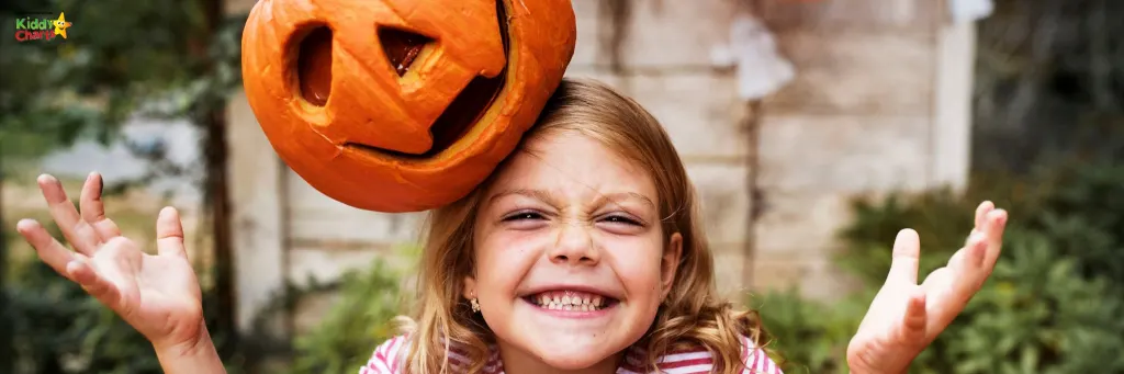 Trick or treating: girl with pumpkin on her head.