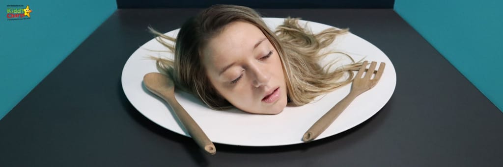 A head on a plate with a spoon and fork - for a Halloween party.