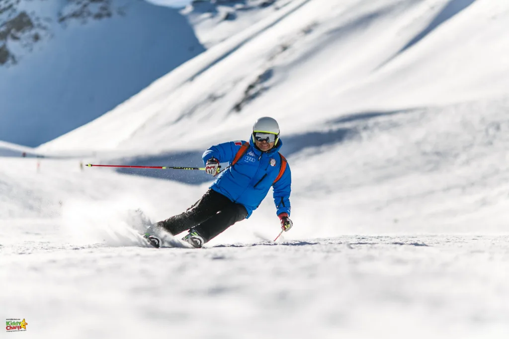 Man ski-ing on slopes.