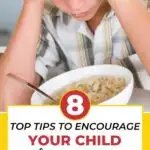 A person holds a sign with text reading "TOP TIPS TO ENCOURAGE YOUR CHILD" while smiling and holding a plate of food.