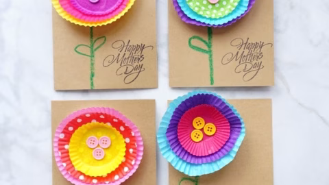 A child is proudly displaying their handmade craft to celebrate Mother's Day.