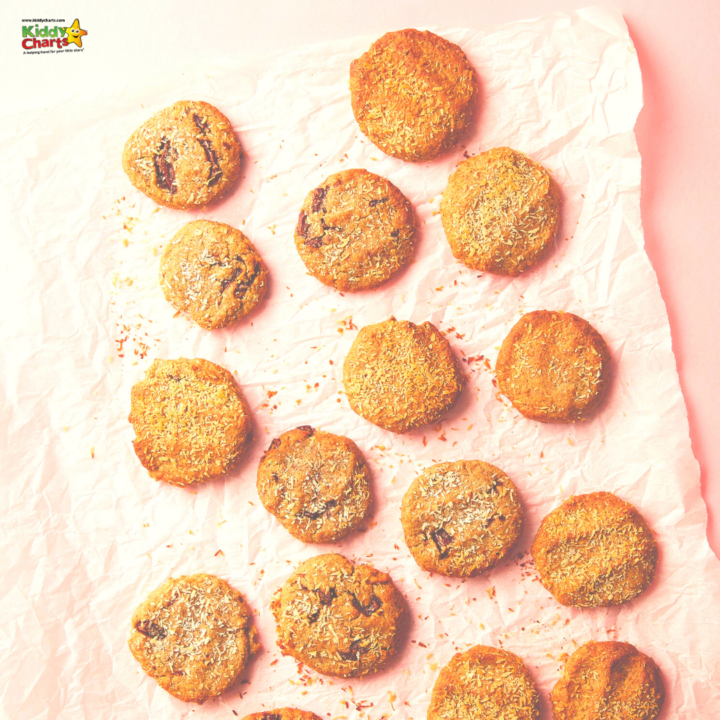 A child is happily baking a variety of cookies, crackers, and other baked goods to create a delicious snack of finger food.