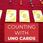 The image shows a counting activity using Uno cards for toddlers to learn basic math skills on the website www.KiddyCharts.com.