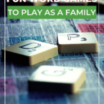 A family is playing four fun word games together to have fun and keep score.