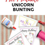 A person is using white glue to assemble a unicorn bunting to celebrate a birthday.
