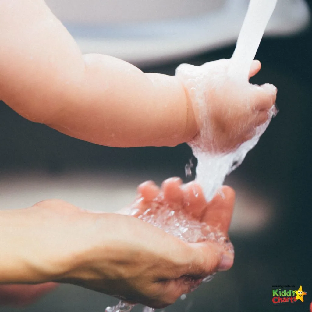 parent and baby washing hands