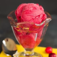 A variety of frozen desserts, including ice cream, gelato, sherbet, and sorbet, are displayed indoors, providing a sweet and creamy treat.