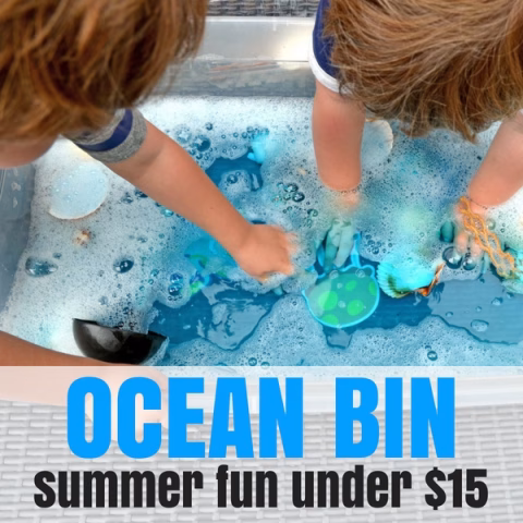 A person and toddler splash in the ocean, enjoying the summer fun together.