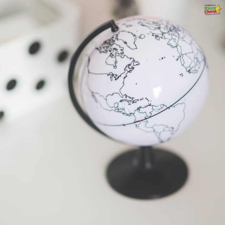 A colorful sphere globe sits atop a Kiddy Charts desk, illuminating the indoor space.