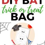 The image depicts a DIY bat-shaped trick-or-treat bag that can be downloaded from Kiddy Charts website.