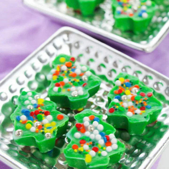 A colorful array of confectionery desserts on a LEGO ECCEL Kiddy Charts board inside a room.