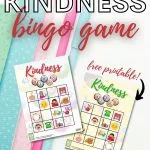 A group of people are playing a game of kindness bingo, using a free printable provided by KiddyCharts.com.