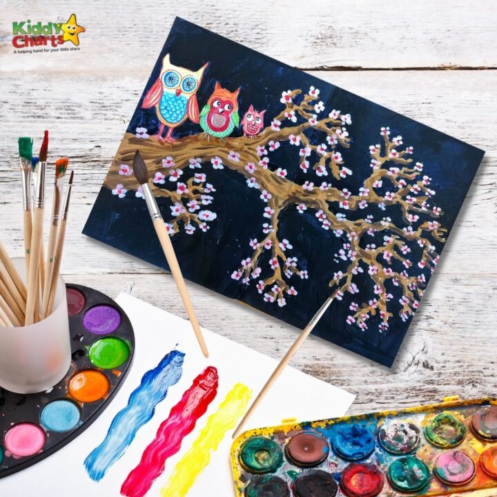 A child is creating a colorful painting with a handmade craft pallette.