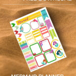 A person is downloading free mermaid planner stickers and checklists from KiddyCharts.com for the year 2023.