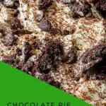 A freshly-baked chocolate pie sits invitingly on a plate, ready to be enjoyed as a delicious dessert or snack.