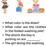 A young person is putting on shorts while a person is doing laundry with a pile of folded clothes and wearing hairbands.