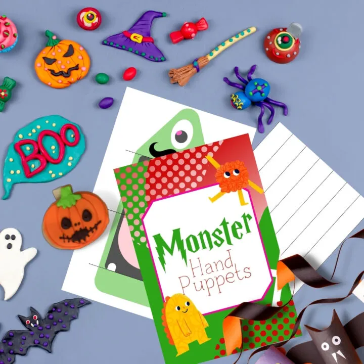 A child is creating a Halloween BOO Monster P Hand puppet with colorful text and art.