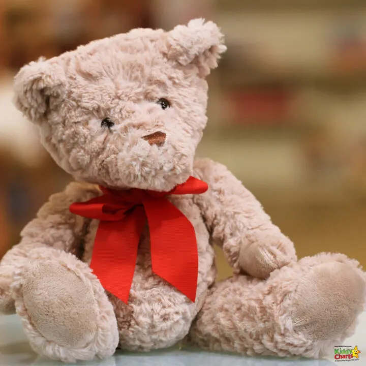 The teddy bear displays a red bow.