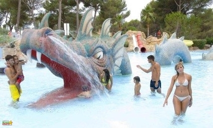 A group of people are playing in a water park.