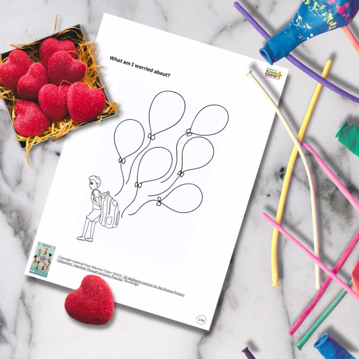 A child is creating a colorful art piece featuring fruit to express their worries.