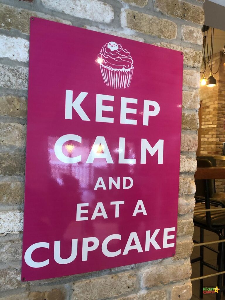 The image depicts a child enjoying a cupcake while being encouraged to stay calm.