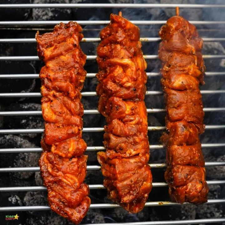 Grilling a variety of meats and vegetables on an outdoor barbecue grill, the image showcases a delicious spread of barbecue dishes from around the world.