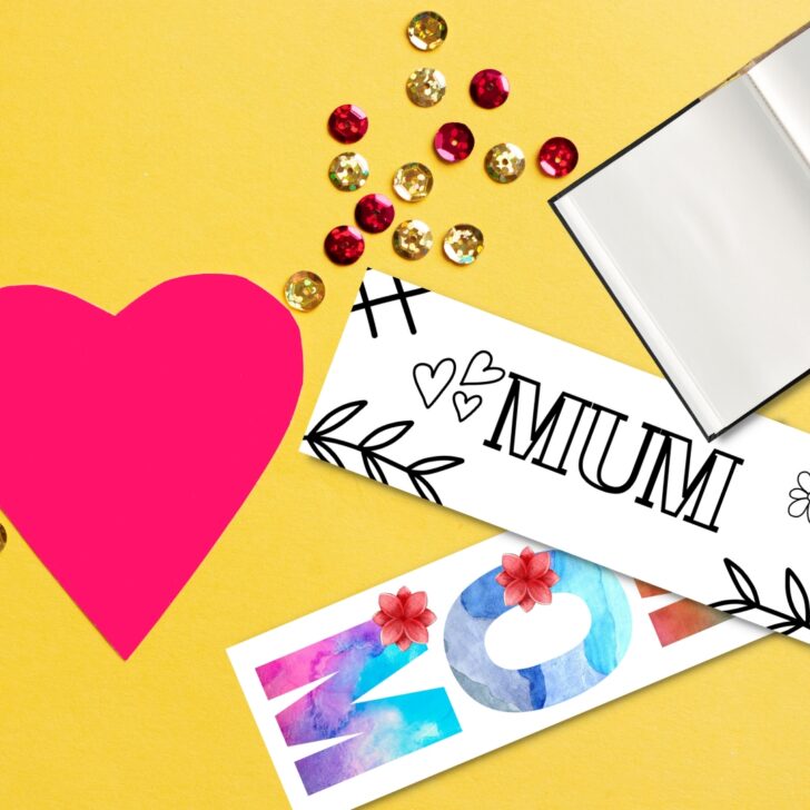 Mothers Day bookmarks on yellow table with glitter, a heart and a book.