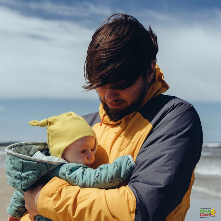 A person is cradling a baby.