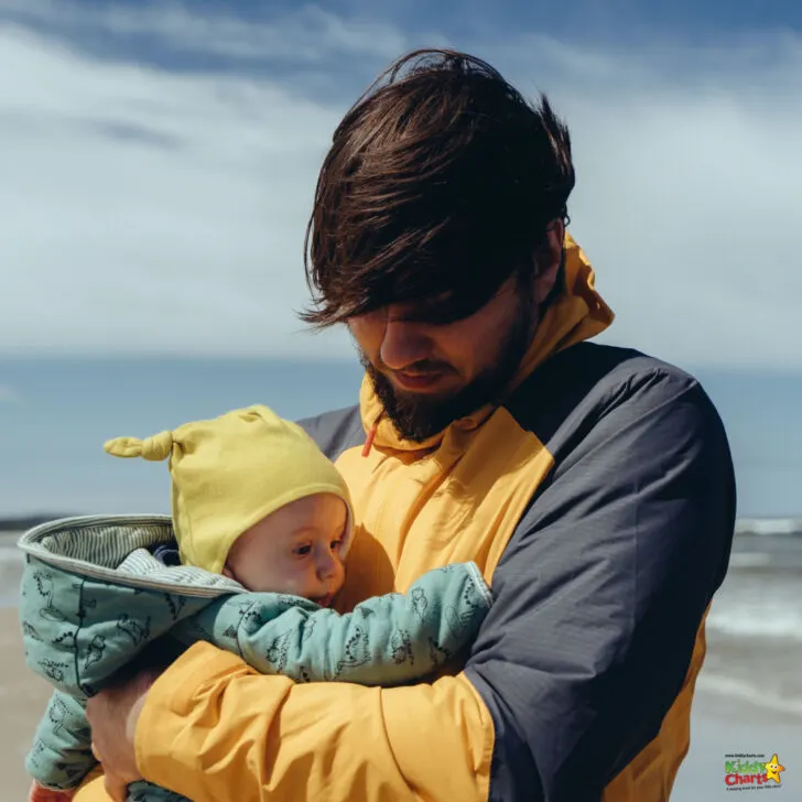 A person is cradling a baby.