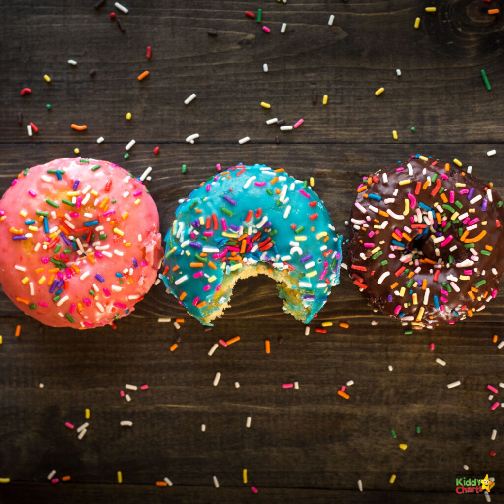 Sprinkles adorn the donuts.