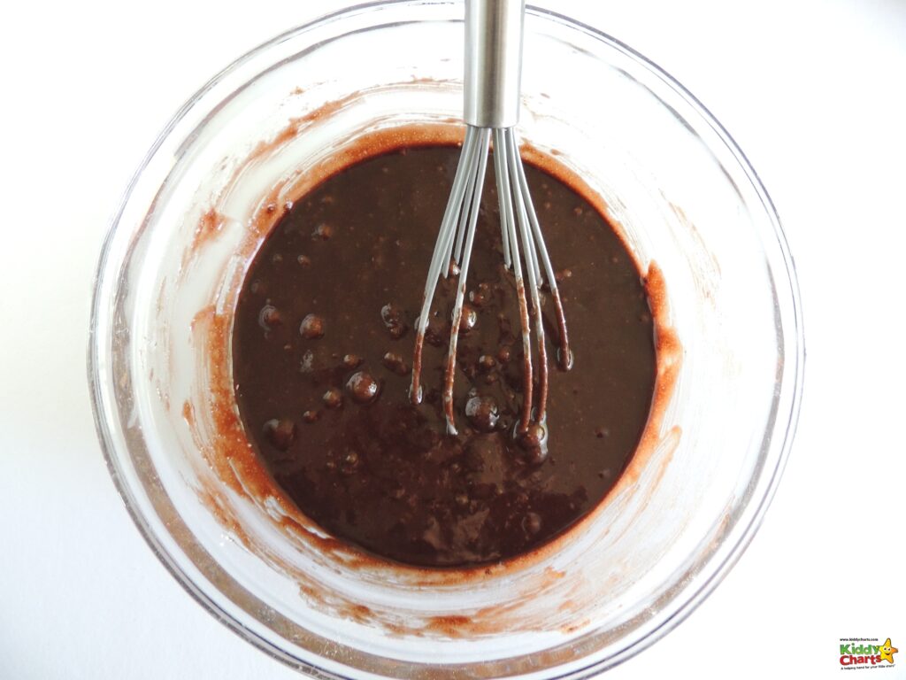 A chef is whisking together a delicious combination of syrup, chocolate, and paste in a kitchen filled with utensils, food, and a potted plant.