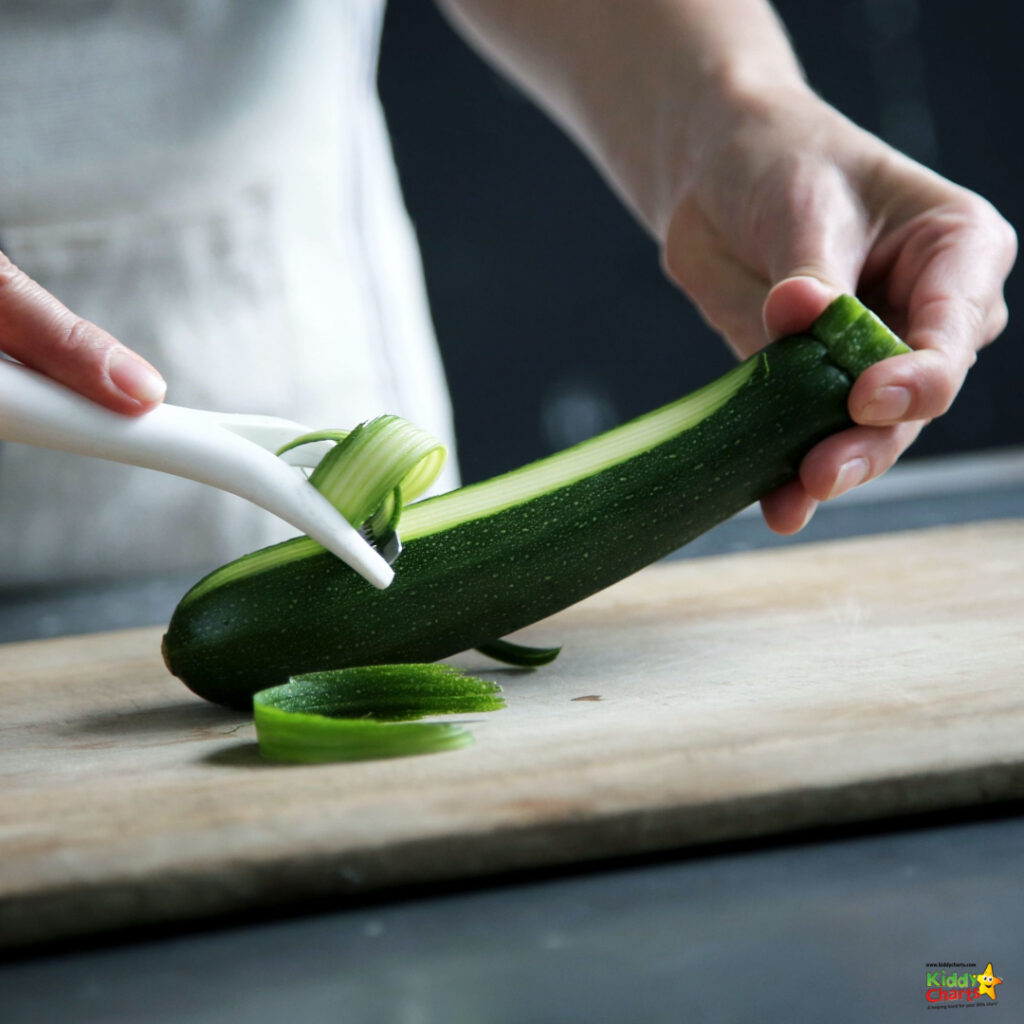 A person is cutting a cucumber.