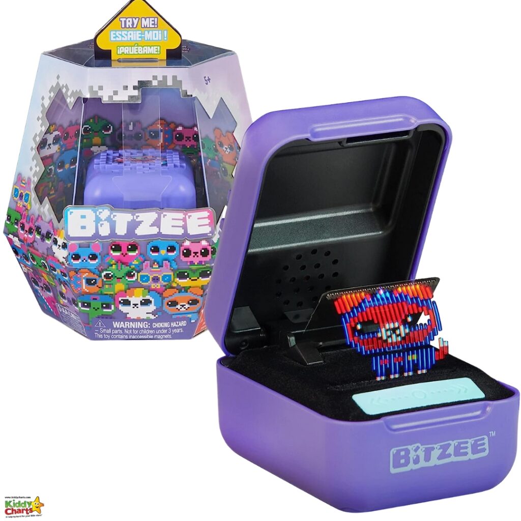 The image shows a packaging and an opened purple toy box labeled "Bitzee" with a pixelated character on a digital screen inside the lid.
