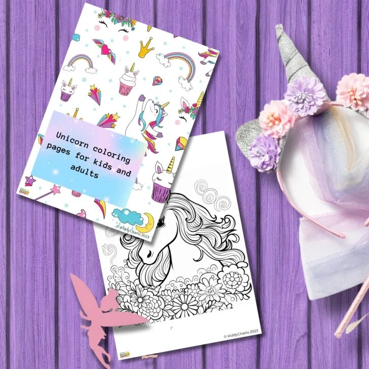 A coloring book with unicorn themes lies atop a purple wooden surface, next to a decorative unicorn headband and a pink fairy wand.