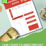 An advertisement featuring a family budget planner. It includes sections for income, expenses, and savings. Toy blocks, a toy car, and a jar of coins surround it.