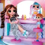 A cartoon toy doll is playing in an indoor playground on the Kiddy Chart 2.