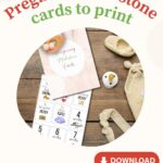 The image displays promotional material for printable pregnancy milestone cards, featuring sample cards, a knitted hat, shoes, and a pacifier on a wooden surface.
