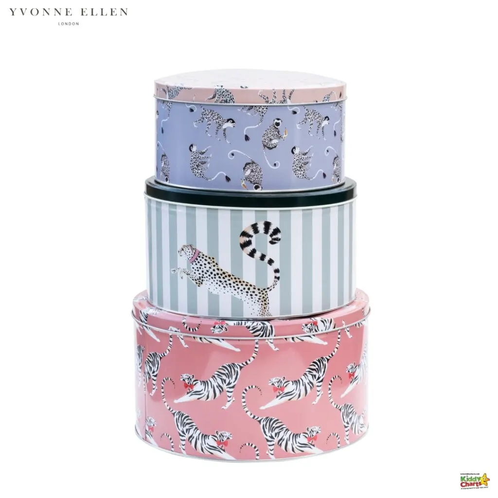 Three stackable decorative tins with animal prints: top tin is lilac with birds, middle tin is green with stripes and a cheetah, bottom tin is pink with tigers.