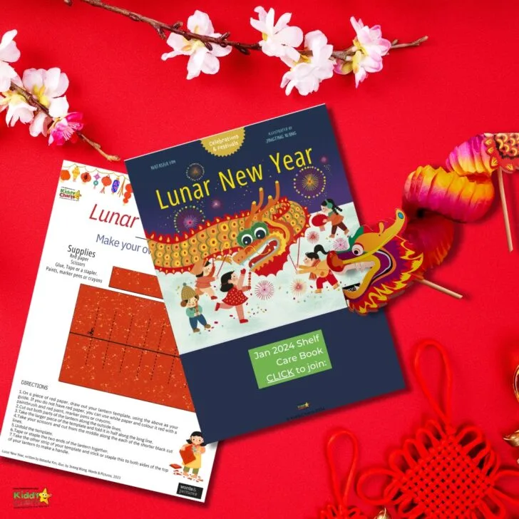 A Lunar New Year themed craft brochure rests on a red background, with cherry blossoms, a paper dragon, and decorative knots also featured.