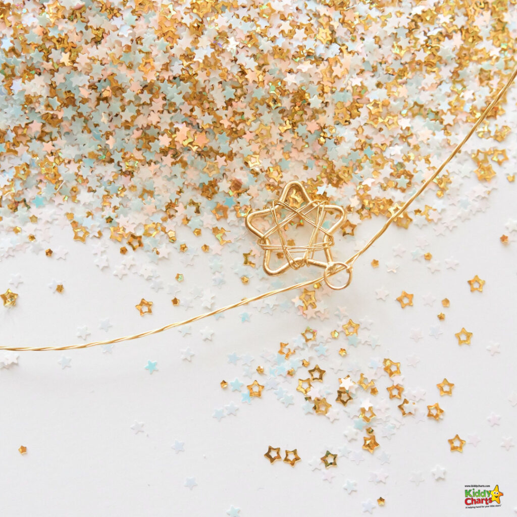 This image displays a myriad of glittery, multicolored star-shaped confetti scattered across a white surface, with a gold star-shaped paperclip resting atop.