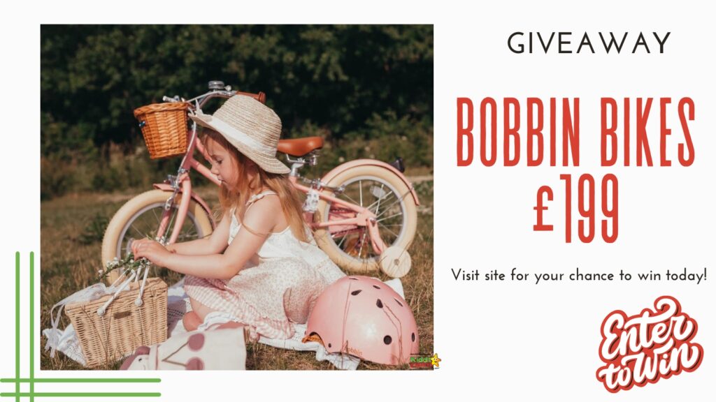A child sits beside a pink bike, holding flowers, next to a picnic basket and pink helmet, with "GIVEAWAY BOBBIN BIKES £199" text overlay.