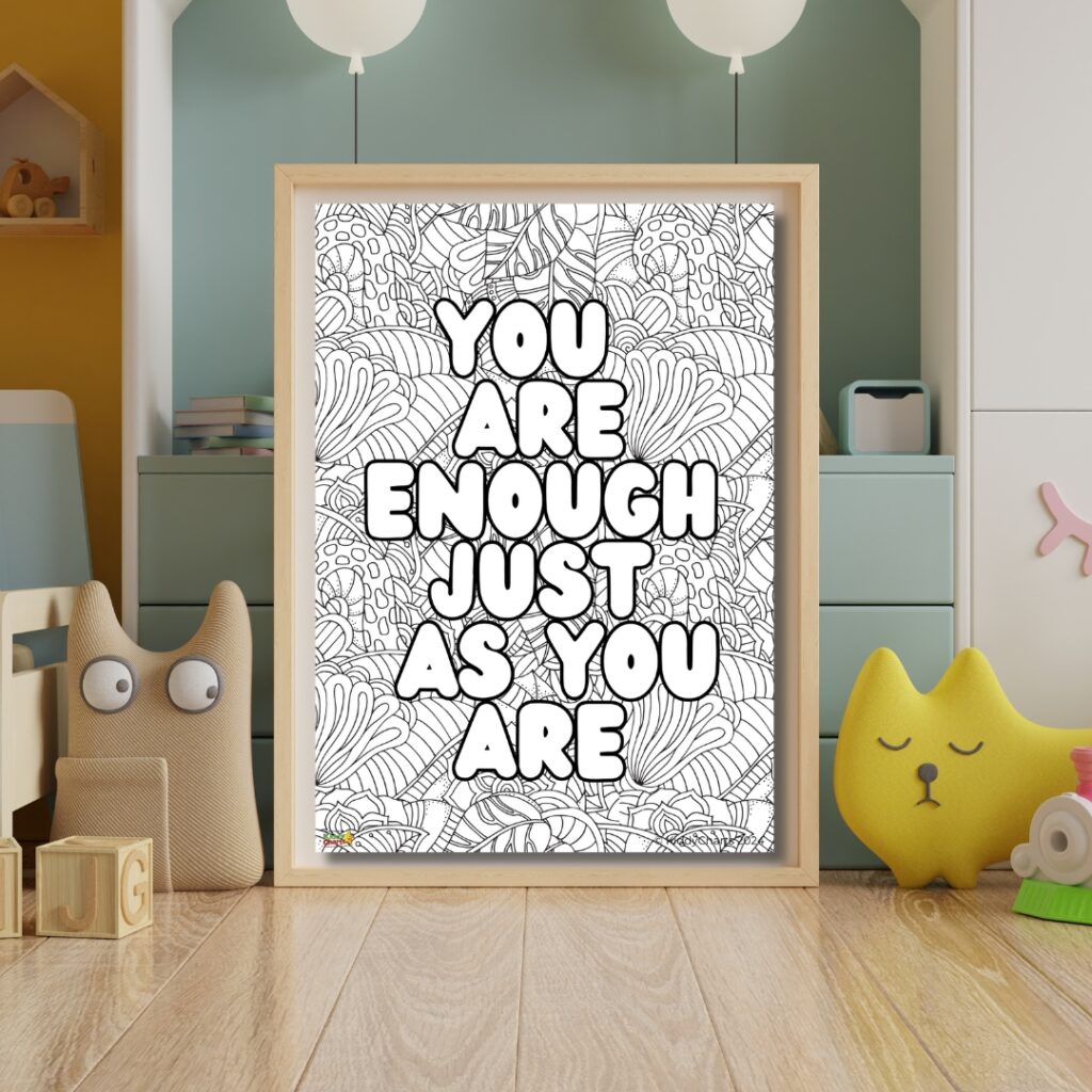 A framed poster with the positive affirmation "YOU ARE ENOUGH JUST AS YOU ARE" hangs in a cozy children's room with playful accessories.