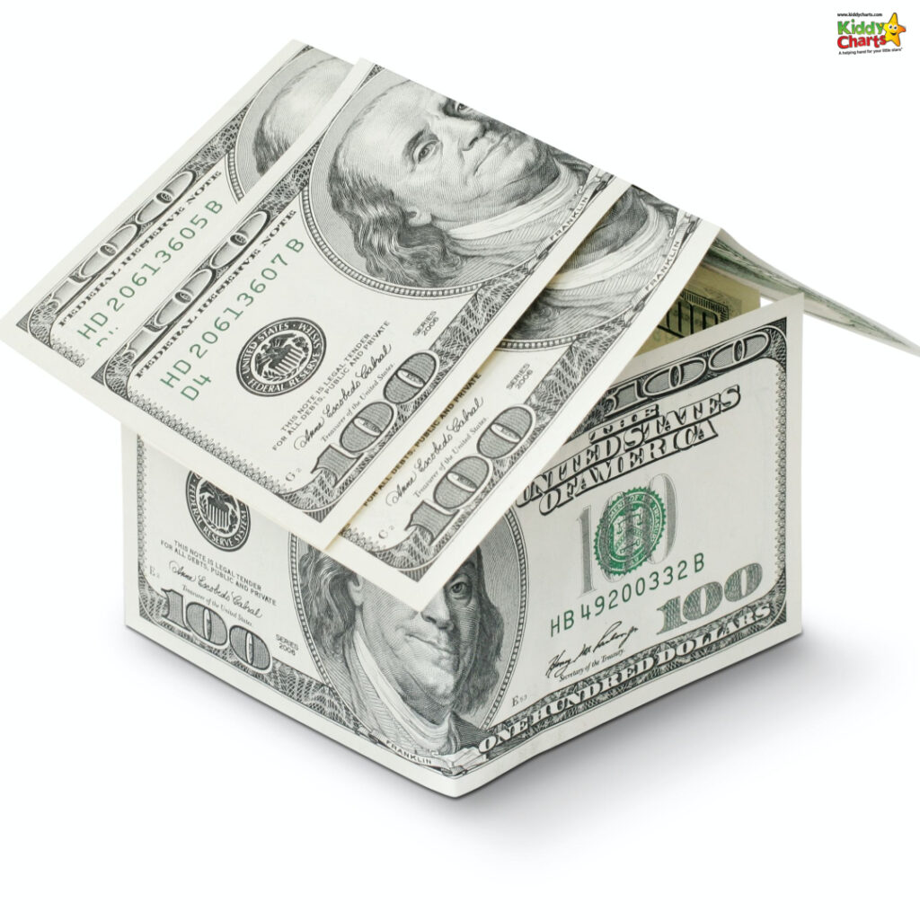 The image features a house-shaped structure made of United States hundred-dollar bills on a white background, showcasing the concept of money or investments.