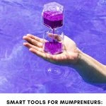 A person's hand holding an hourglass with purple sand over vibrant blue water. Text below discusses tools for balancing business and family.