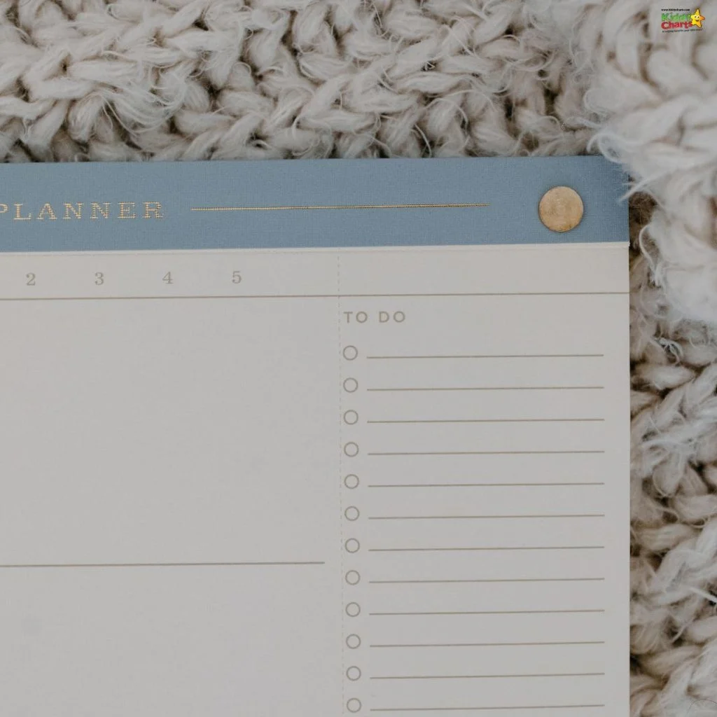 A close-up of an unused planner page with a "TO DO" list, lying on a textured beige knit fabric background.