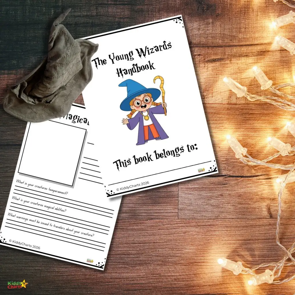 A young wizard-themed workbook lies beside a pointy hat and string lights on a wooden surface, ready for creative exploration.